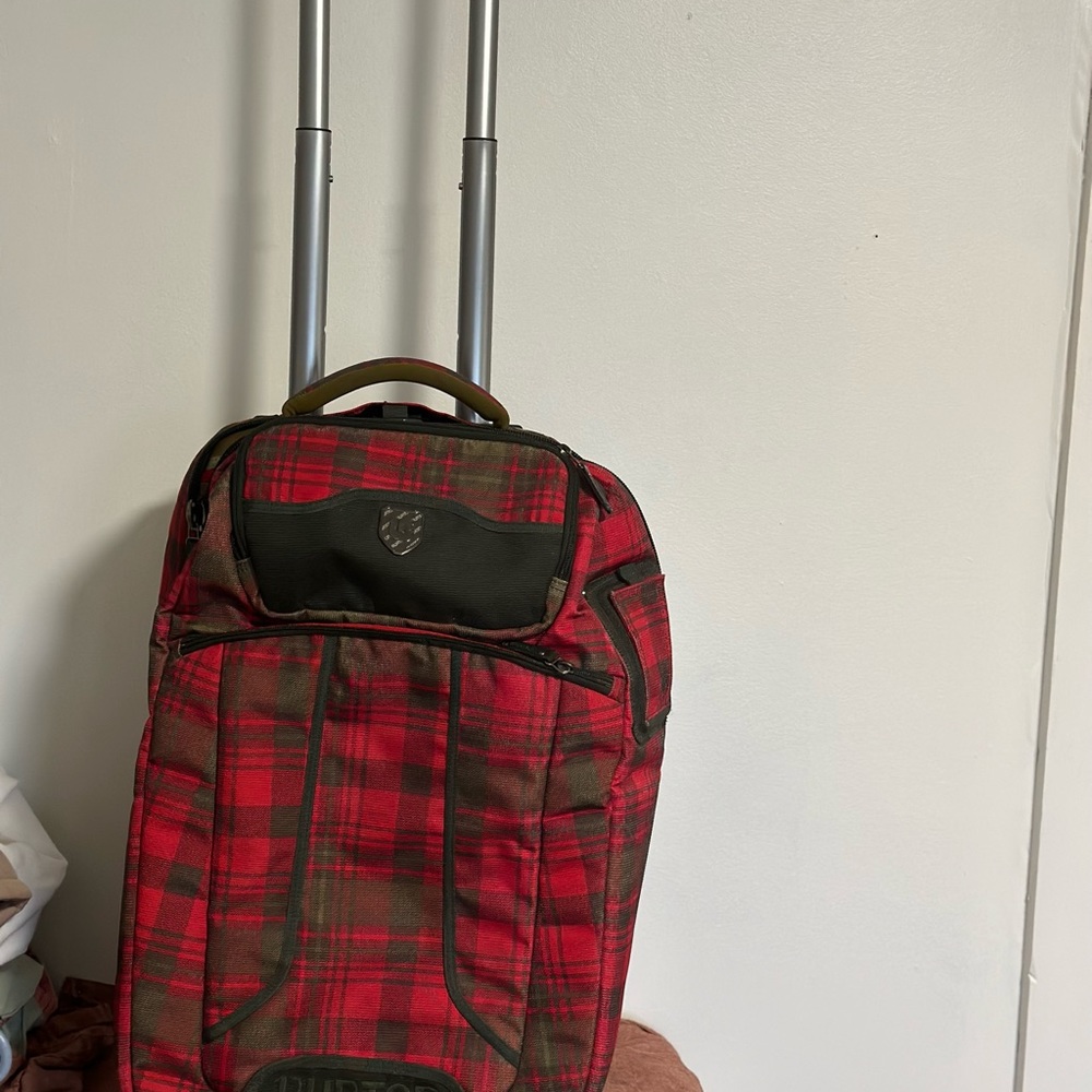 Burton carry on luggage, fits in overhead.  Several pockets, good condition.